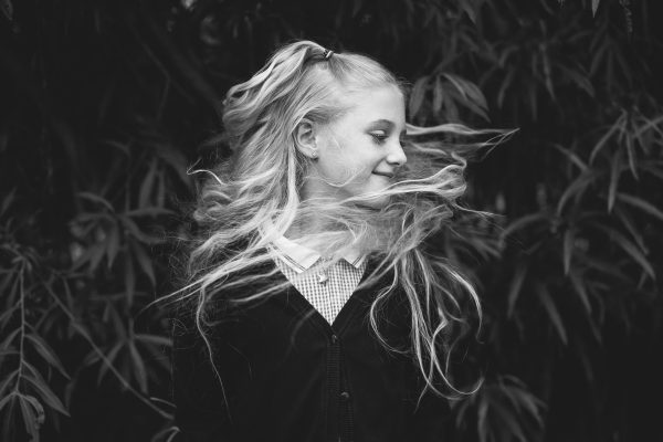 Girl flicking hair in school photos