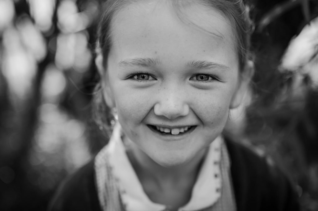 a close-up of a girl smiling